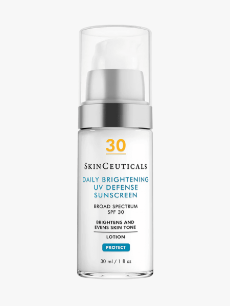 Daily Brightening UV Defense Sunscreen SPF 30 in clear bottle with pump on light gray background